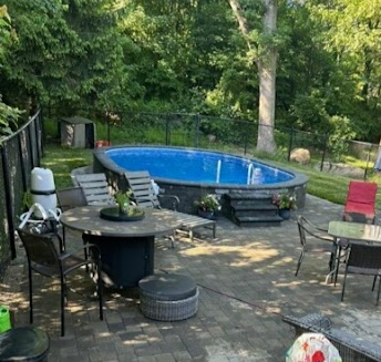 - MGK Pools Inc Aquasport 52 with great hardscaping