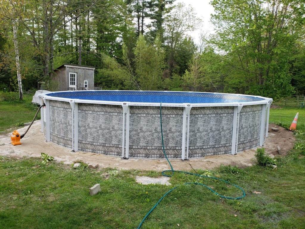 Picture of an above ground pool we are installing, i can see liner vac, and pool hose