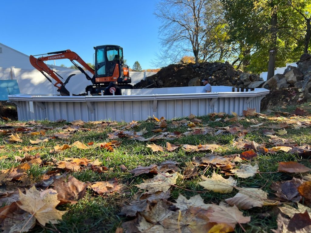 IMG_2840 - MGK Pools Inc My old excavator in backdrop of a semi inground Aquasport 52 pool