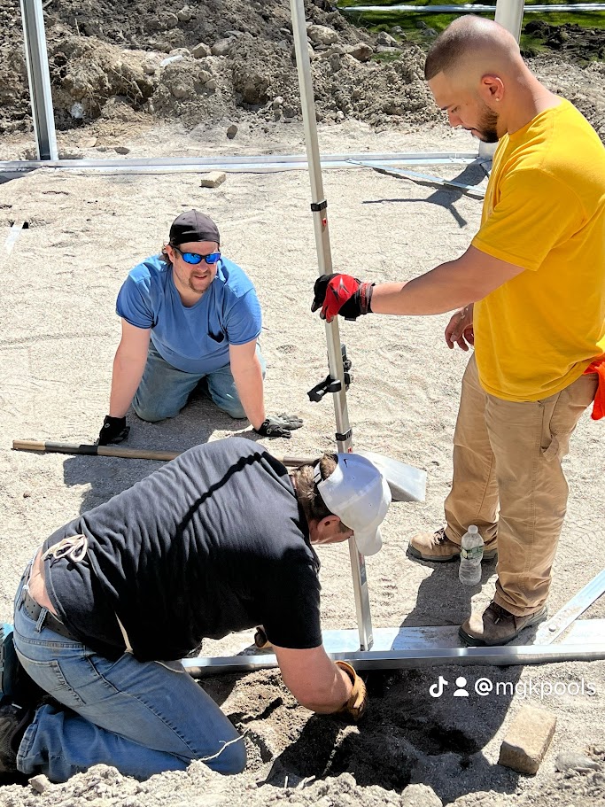 Efrain, Mike and Kenny building a pool