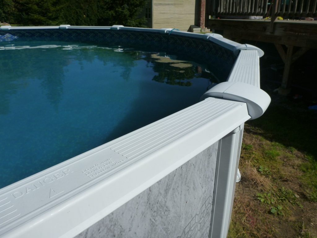 Close up of attractive white above ground pool framing