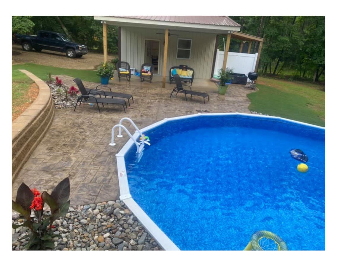 Aquasport 52 semi-inground pool with stone surround
