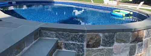 semi-inground-stone-wall-jpeg - MGK Pools Inc Stone work on semi inground installation