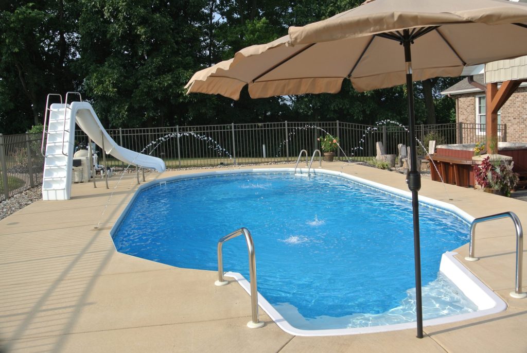 Inground Grecian with Steps and poured cement patio