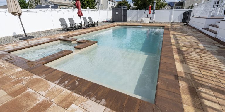 Fiberglass pool installed in a beautiful backyard