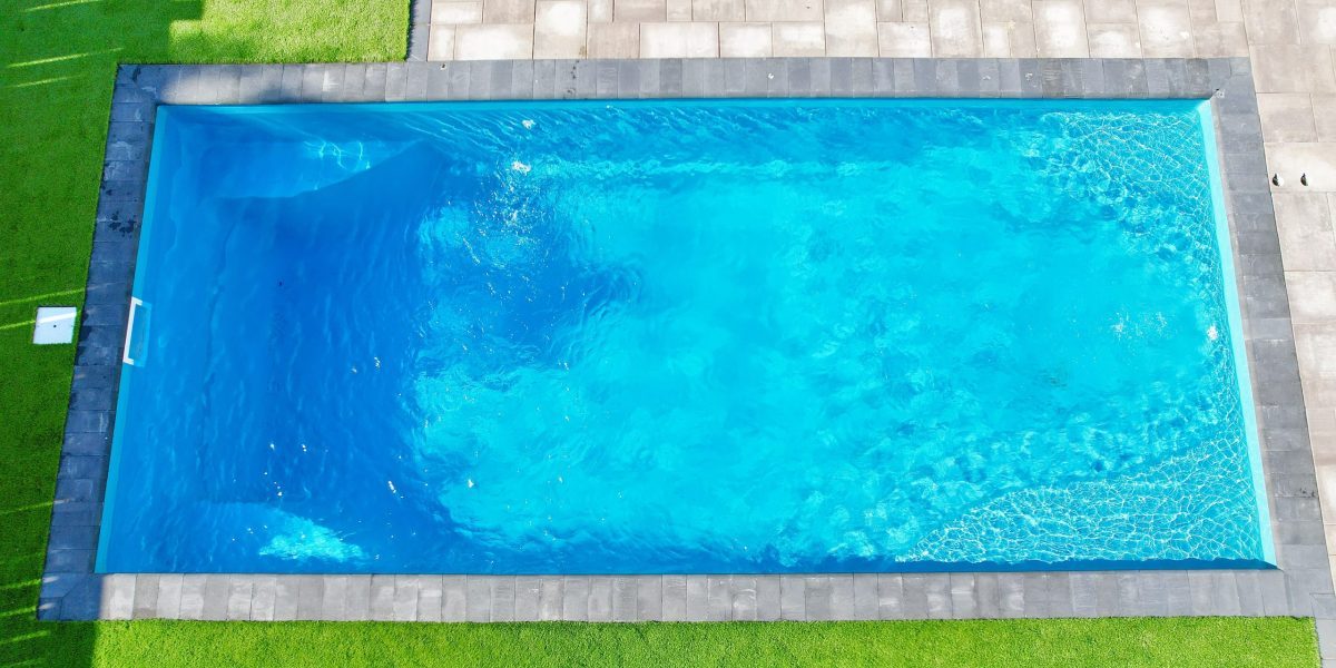 12x26-fiberglass-pool-empire-fiberglass-pool-install-4 - MGK Pools Inc Empire fiberglass pool by Glimmerglass - real installation photo, installed complete by MGK Pools