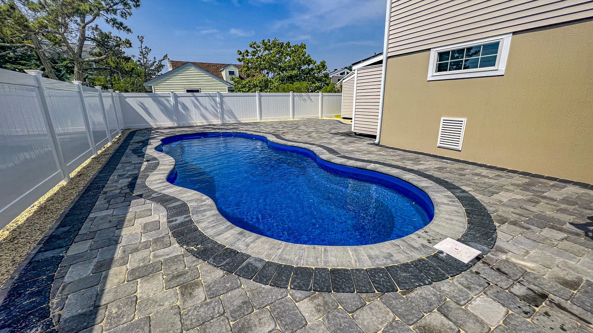 13x33-fiberglass-pool-oasis-fiberglass-pool-install-1 - MGK Pools Inc Oasis fiberglass pool by Glimmerglass - real installation photo, installed complete by MGK Pools