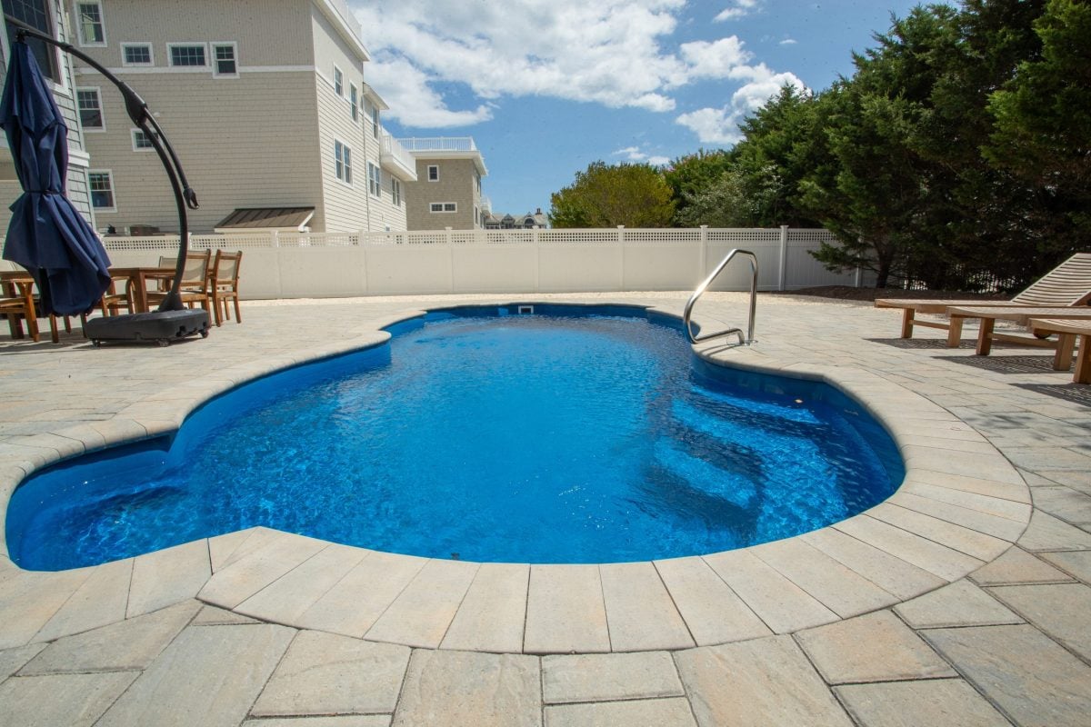 15x32-fiberglass-pool-nassau-fiberglass-pool-install-1 - MGK Pools Inc Nassau fiberglass pool by Glimmerglass - real installation photo, installed complete by MGK Pools
