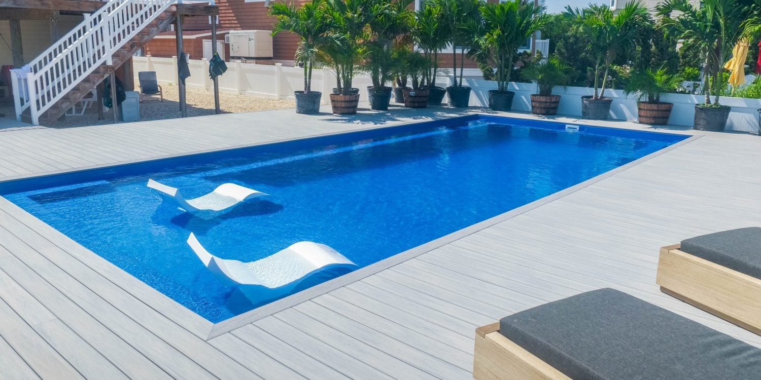 ponce-xl-fiberglass-pool-install-photo-1 - MGK Pools Inc Ponce XL fiberglass pool by Glimmerglass - real installation photo, installed complete by MGK Pools