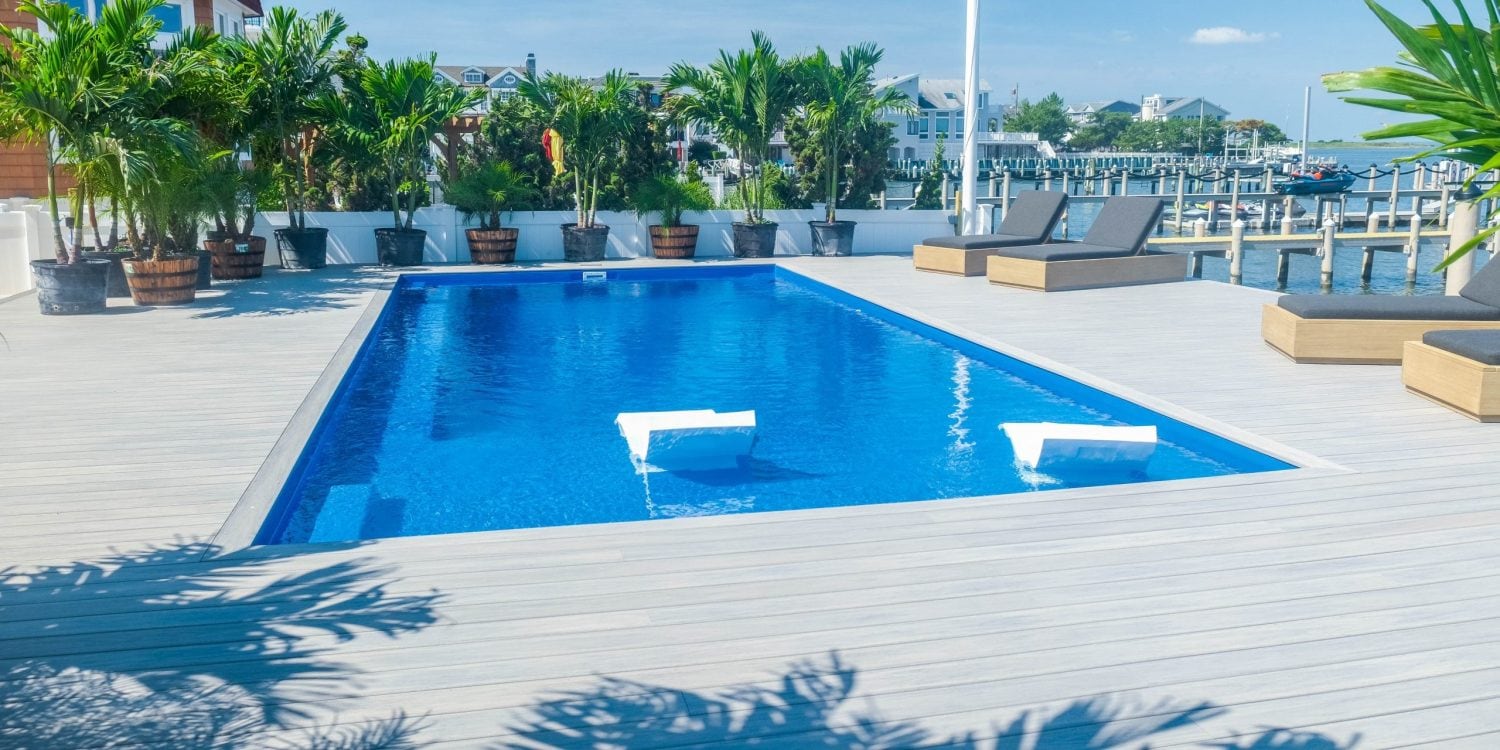 ponce-xl-fiberglass-pool-installed-2 - MGK Pools Inc Ponce XL fiberglass pool by Glimmerglass - real installation photo, installed complete by MGK Pools
